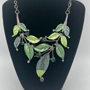 Metallic green leaves on dark silver vine statement necklace